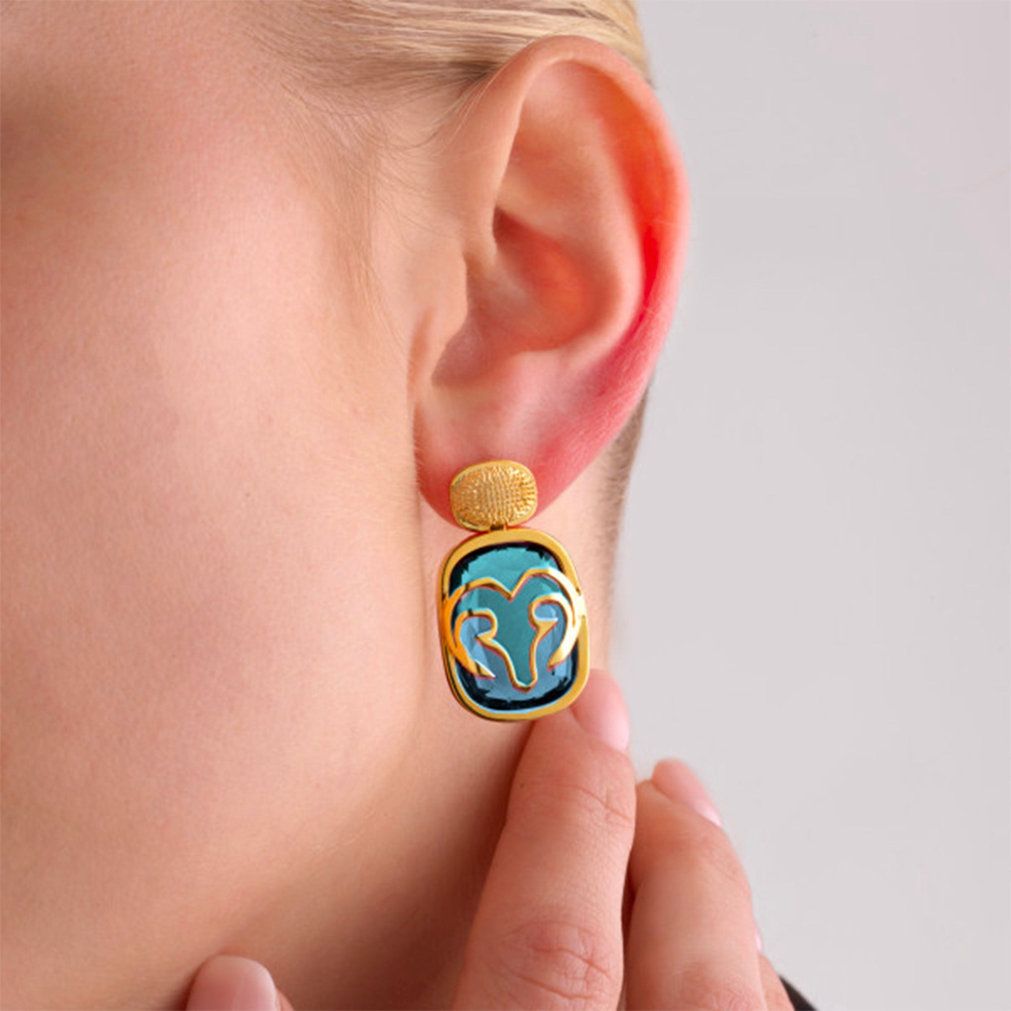 The Maje Earrings worn by a model