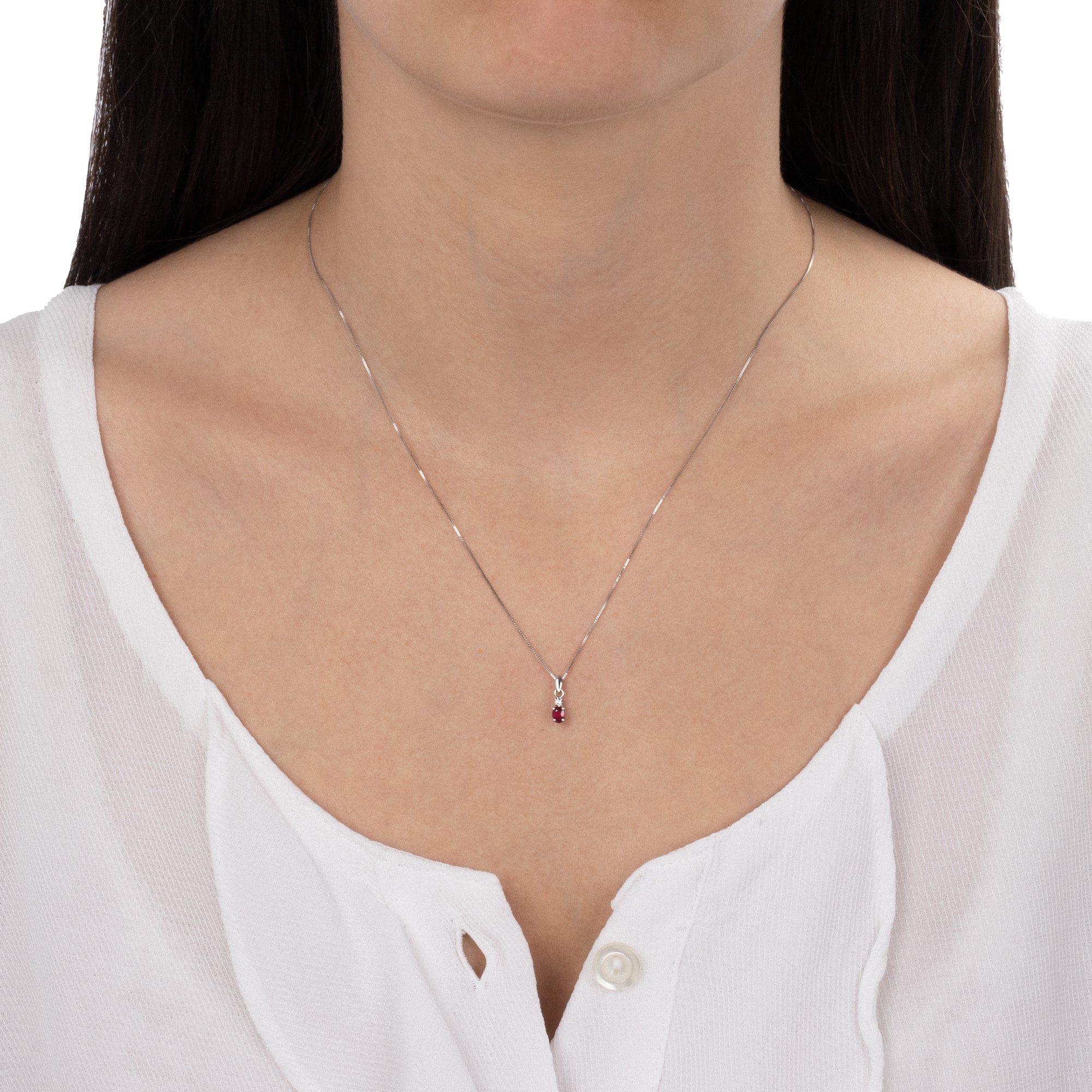 Worn Necklace With Diamond And Oval Ruby Pendant